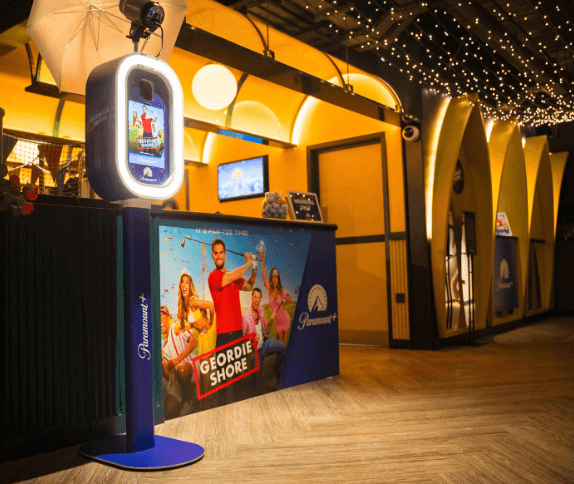 Mobile Moments AI Photo Booth with custom themed display at an event