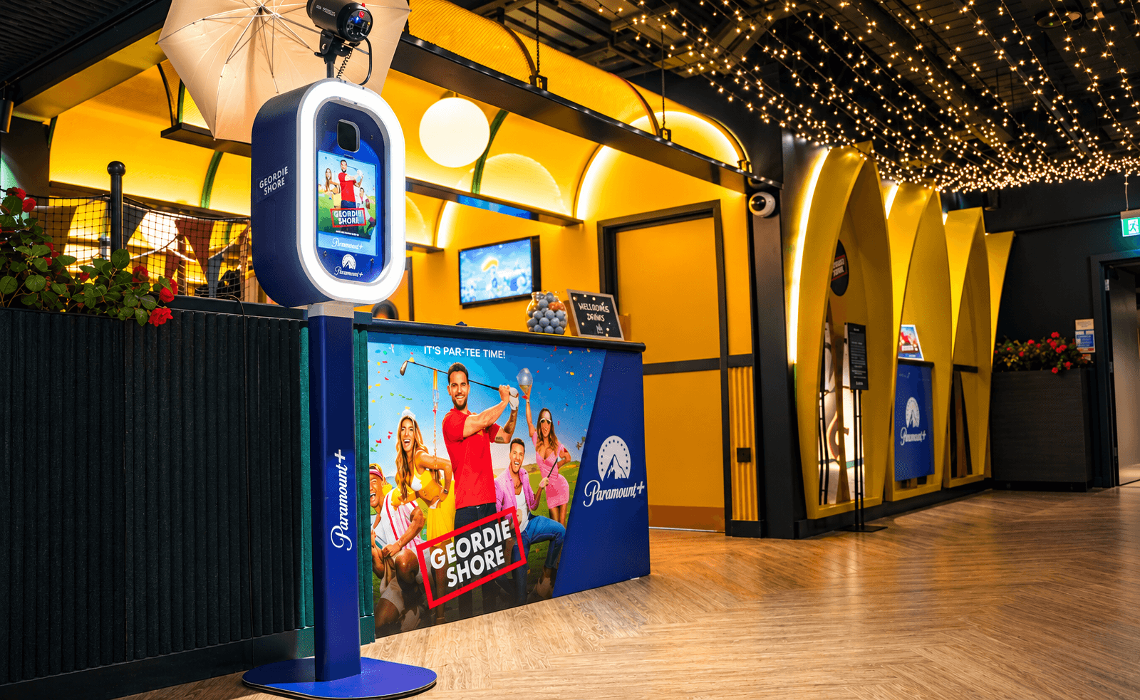 Branded Glam Pod photo booth at a Paramount event venue with interactive display and lighting